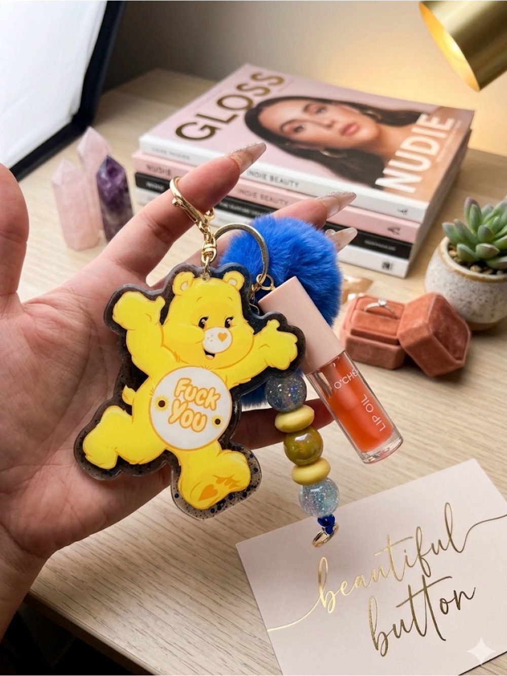 Custom Junk keychain 
Yellow Bear Keychain with Blue Pom Pom